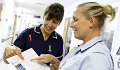 Sue Crossfield talks to Donna Cross during a care round at QEHB