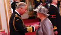 Image of the Prince of Wales and Dame Julie Moore at Buckingham Palace