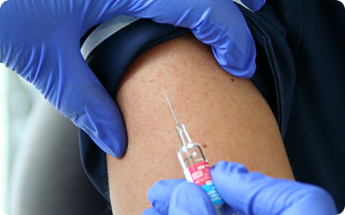 Flu vaccination being given