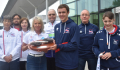image: Lisa Wilson with Tom’s Baton and members of Birmingham Adult Transplant Sport Team