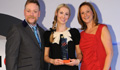 Rosie Sanderson collects the Healthcare and Pharmaceutical Award on behalf of UHB from PRCA Awards host Rufus Hound