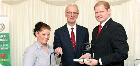 Louise Ormsby receives Patient Transport Award from Lord Ian McColl (with Adam Layland receiving on behalf of Alex Laston)