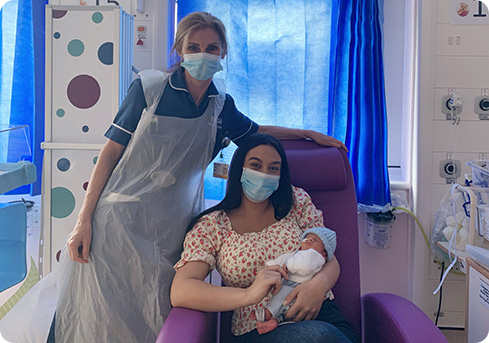 Image: Neonatal Nurse Suzanne Michael with Tia and baby Romeo