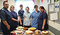PHOTO: Neurology team with Bake-off cakes