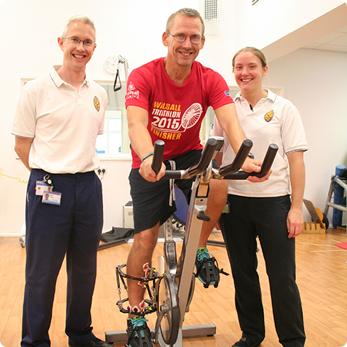 Peter Gibson with physiotherapists Mark Raven and Sophie Aitchison