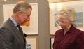 Prince Charles with some of the works from Paintings for Hospitals at Selly Oak Hospital in 2009