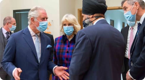 Their Royal Highnesses The Prince of Wales and The Duchess of Cornwall speaking to members of staff at University Hospitals Birmingham NHS Foundation Trust