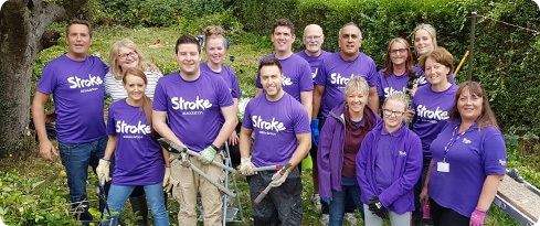Image: volunteers helping a stroke survivor with a garden makeover