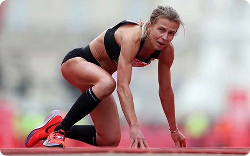 Image: Hayley struggles to cross the finish line at the London Marathon