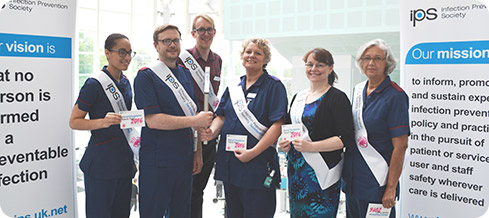 QEHB staff with the Infection Prevention Society torch