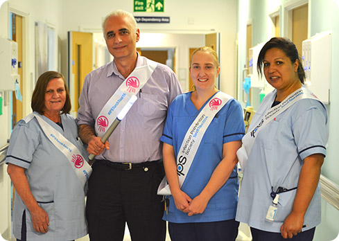 QEHB staff with the Infection Prevention Society torch