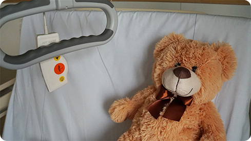 Image: teddy bear on a hospital bed